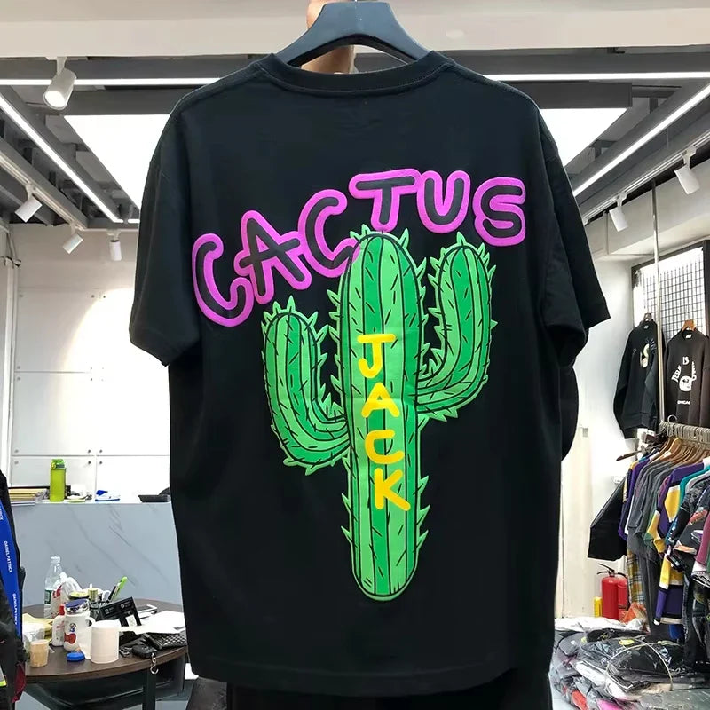 Black cotton hip hop t shirt with vibrant green cactus graphic and pink and yellow cactus jack lettering streetwear top