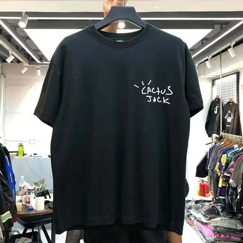 Black cotton hip hop t shirt with white handwritten cactus jack logo for streetwear fashion in 2026 collection