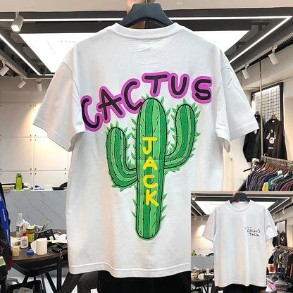 White cotton hip hop t shirt with vibrant green cactus graphic and bold pink and yellow cactus jack lettering streetwear