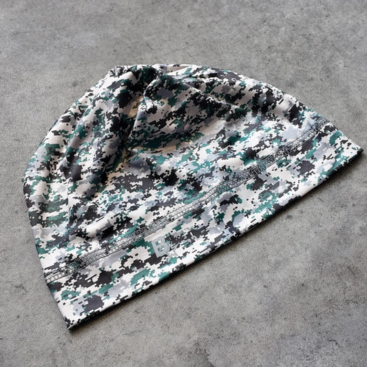 A soft stretchy unisex hip hop beanie with green black gray digital camouflage pattern for casual street style