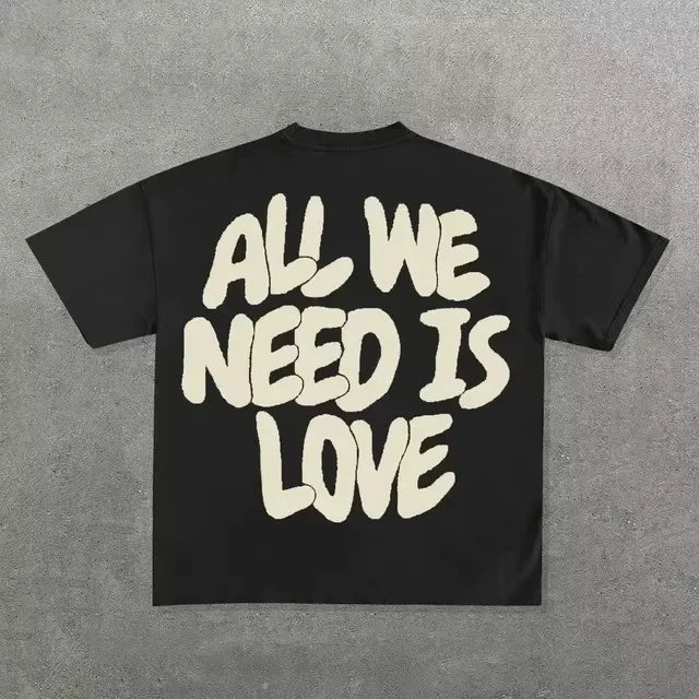 Black cotton round neck t-shirt with bold cream hip hop letter graphic on back for neutral street cool style