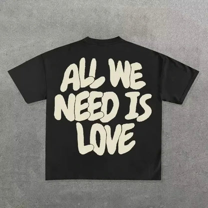 Black cotton round neck t-shirt with bold cream hip hop letter graphic on back for neutral street cool style