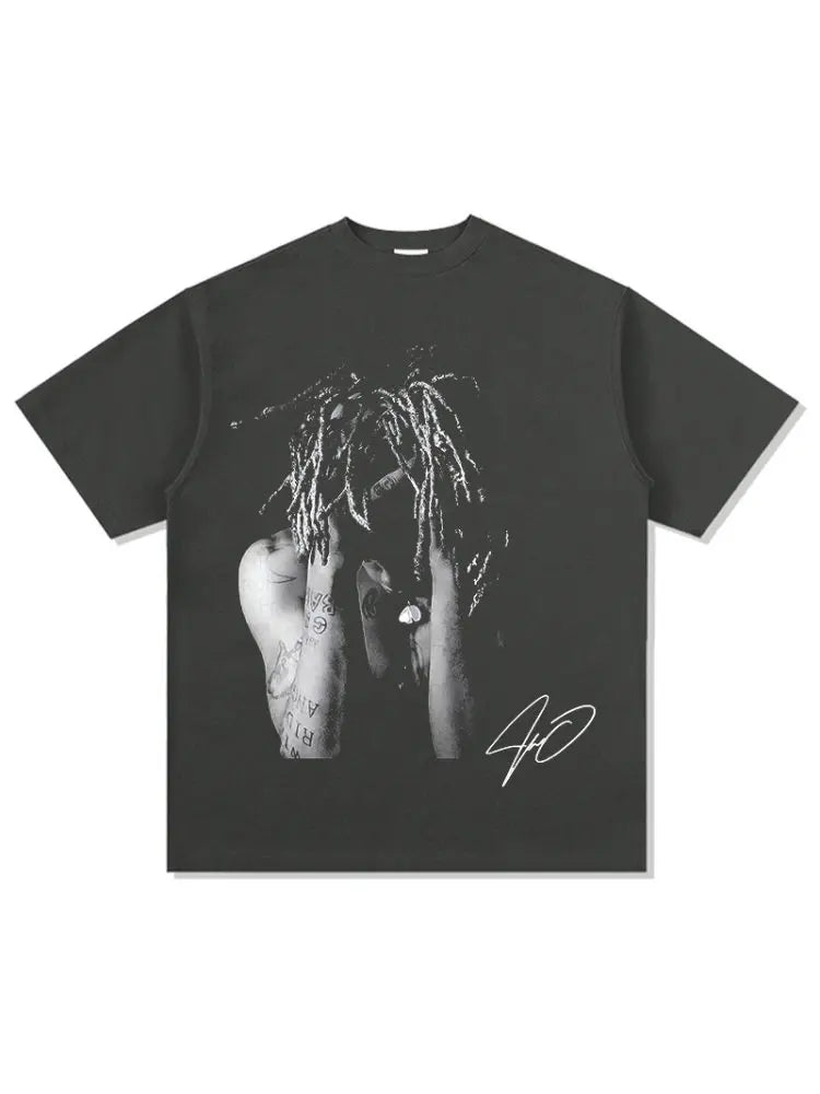 Black oversized t-shirt featuring a black and white graphic of a person with dreadlocks and tattoos in vintage print