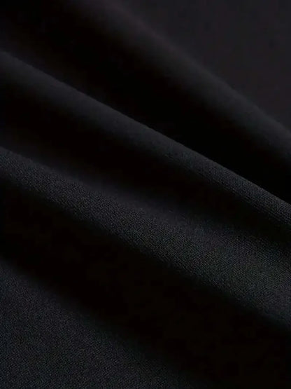 Black satin fabric with a smooth glossy finish and subtle sheen featured in a 2026 XXXTentacion hip hop t-shirt