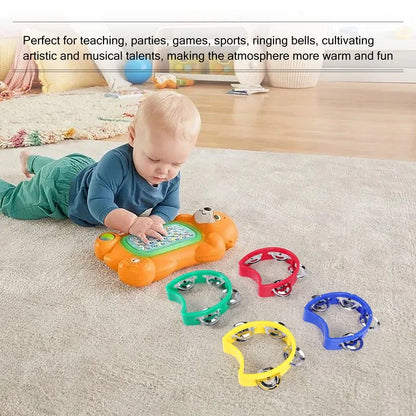 Orange plastic bear-shaped musical toy with green keyboard and silver bells for handheld tambourines percussion rhythm