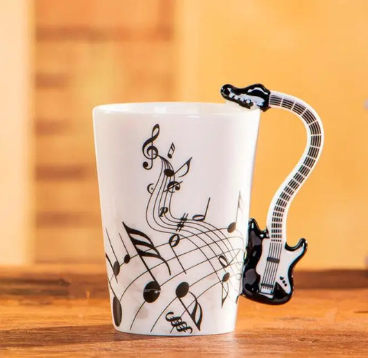 White ceramic 240ml creative music ceramic mug guitar with a black guitar-shaped handle and musical notes print