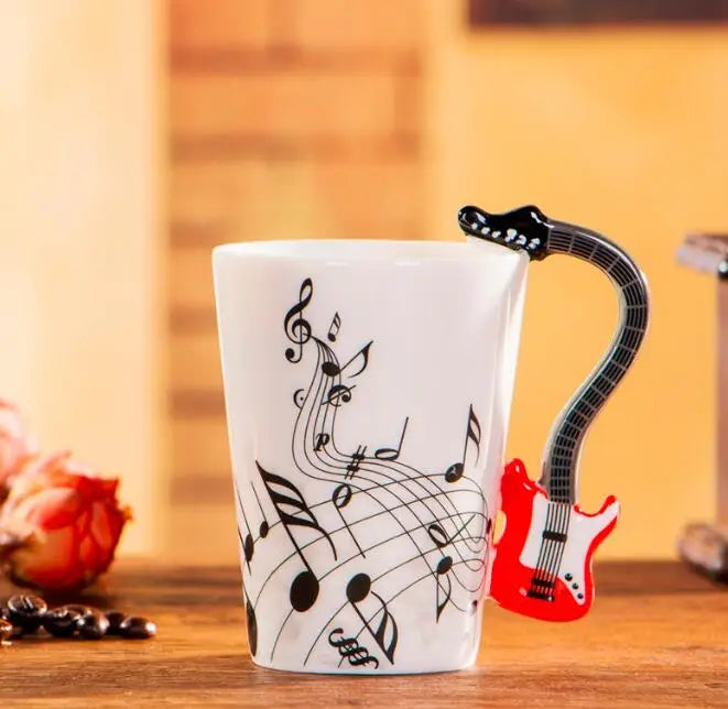 White ceramic 240ml creative music mug featuring black musical notes and a red ceramic mug guitar handle design