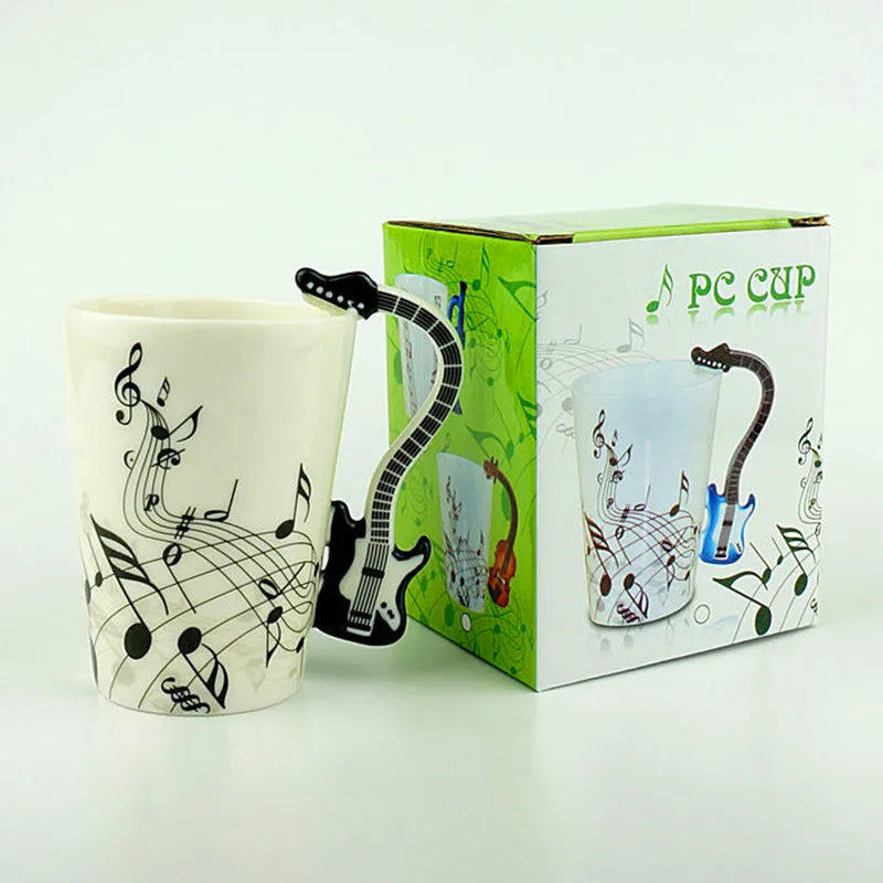 White ceramic 240ml creative music mug with a black ceramic mug guitar handle and printed milk stave notes design