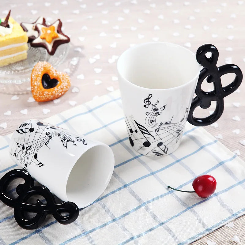 White ceramic 240ml creative music mug with black musical notes and glossy black treble clef handle for tea or milk