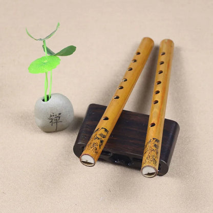 Two light brown 24cm Chinese traditional 6 holes bamboo flutes with black engravings on a dark wooden stand for clarinet student elementary use