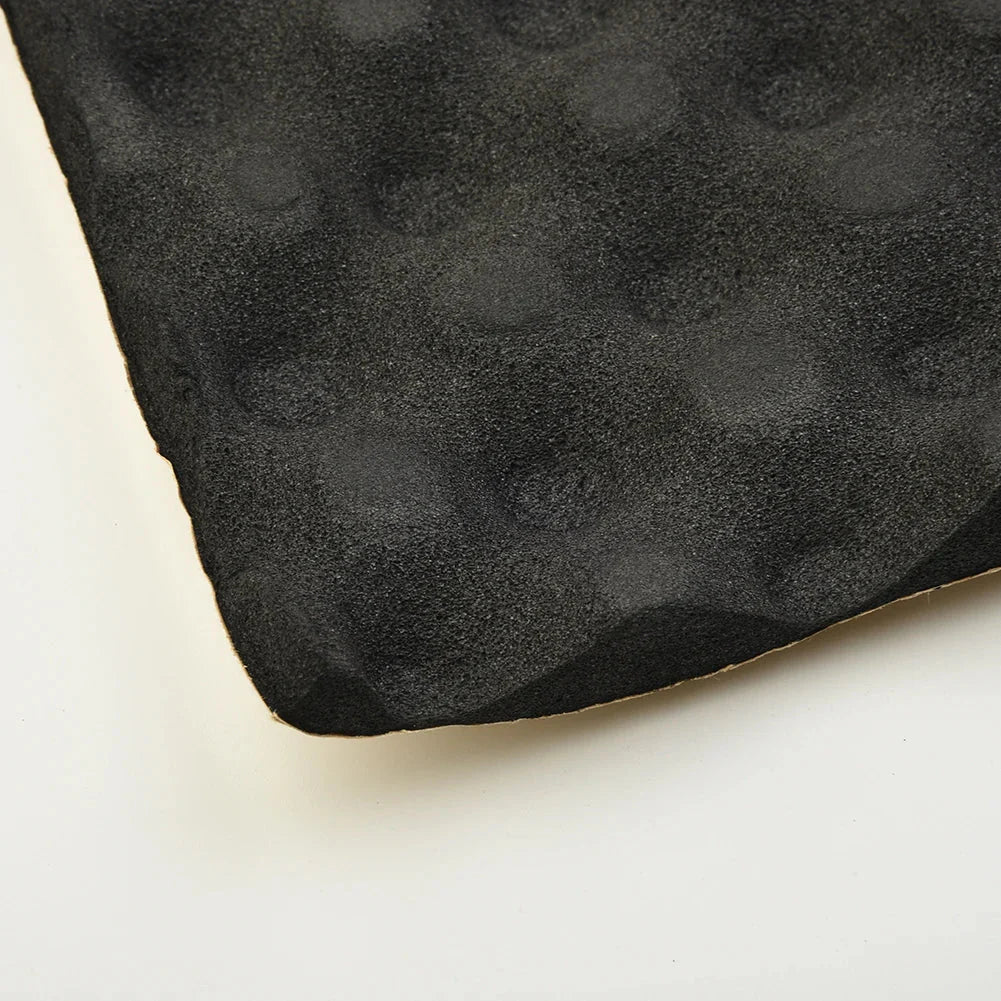 Black textured foam car sound deadener pad with matte finish and raised circular bumps for car acoustic thermal use