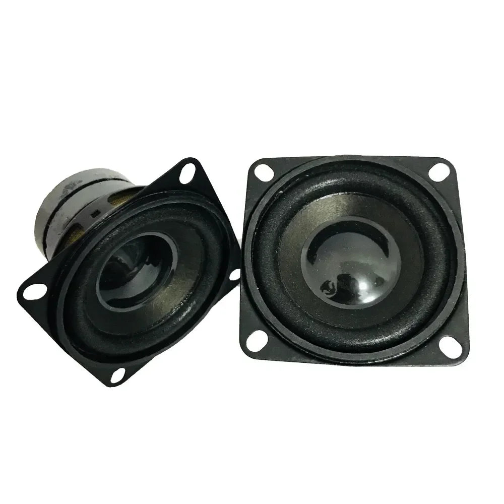 Black square-shaped mini dual magnetic speakers with glossy finish and metallic center cones for portable audio use