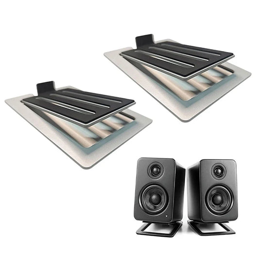 Black rectangular desktop speakers with matte finish and dual drivers mounted on matching black desktop speaker stands
