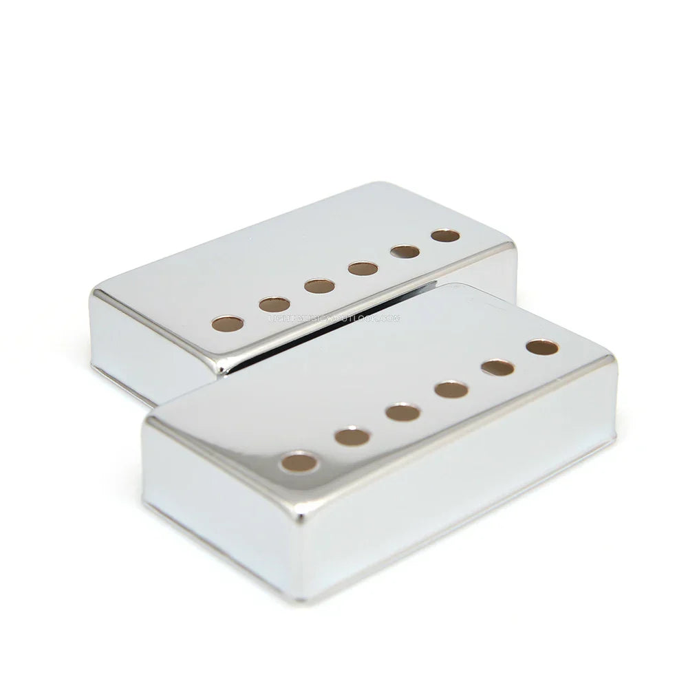 Two chrome humbucker lp guitar pickup covers with 50mm pole spacing and six adjustable pole pieces each