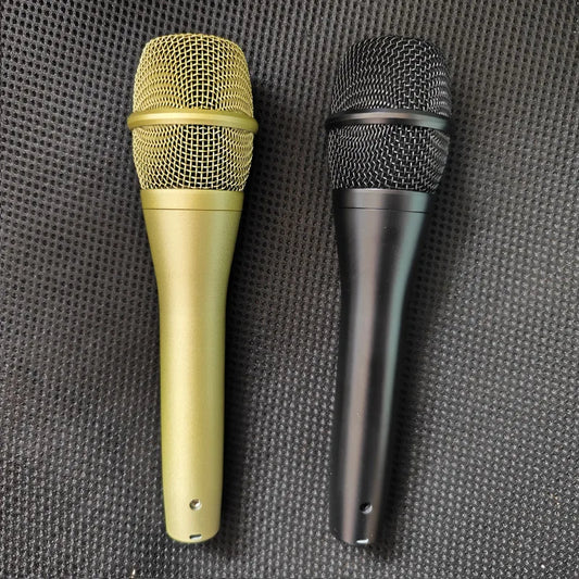 Two handheld ksm9 professional karaoke microphones with gold metallic and matte black finishes for clear sound stage performance