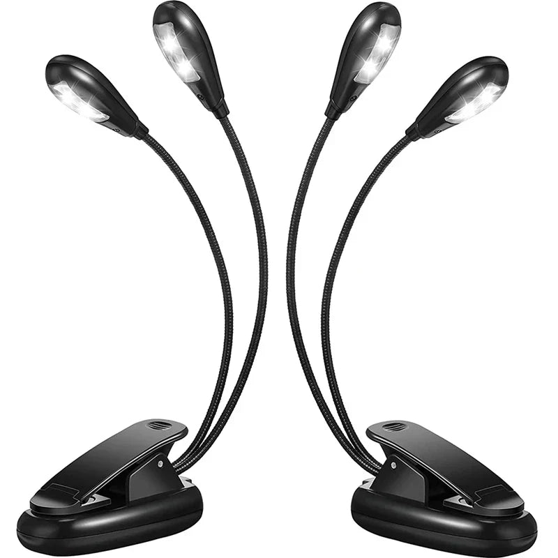 Set of four black flexible clip-on led book lights with adjustable gooseneck and 360 degree adjustable clip for music stands