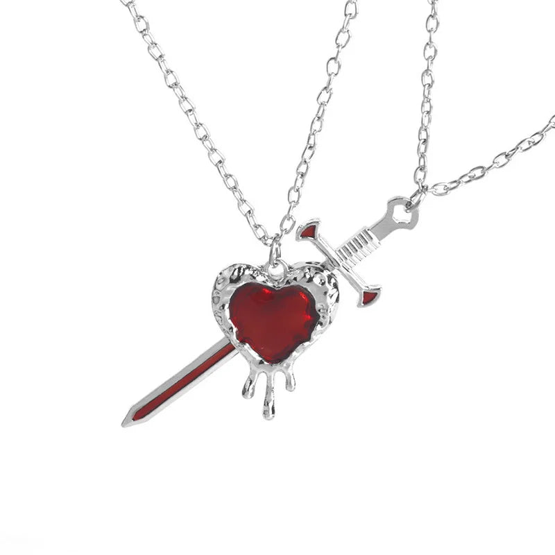 Silver sword piercing red heart pendant with dripping effect on delicate chain in 2pcs swords heart punk heart matching necklace