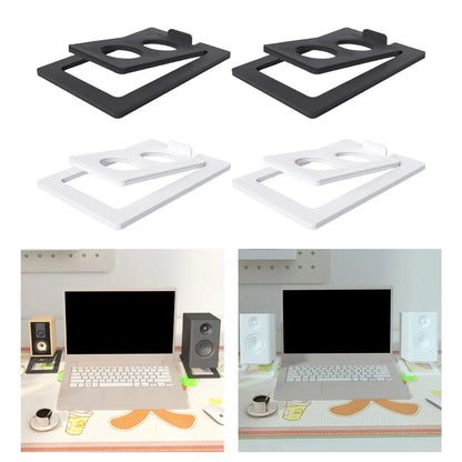 Black and white plastic 2pcs tilted desktop speaker stands with circular cutouts for studio speakers and laptops