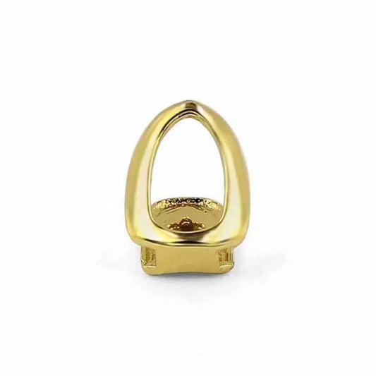 Gold-colored polished metal single shackle teeth grill with sleek oval design and engraved detailing for hip hop jewelry