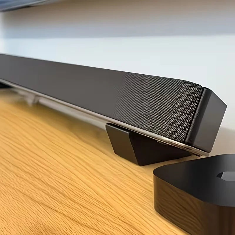 Black soundbar with textured grille on 2pcs universal soundbar stand bases compatible with sony philips samsung TVs
