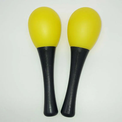 A pair of bright yellow and black plastic maracas sand hammer rattle shaker percussion musical instruments with textured handles