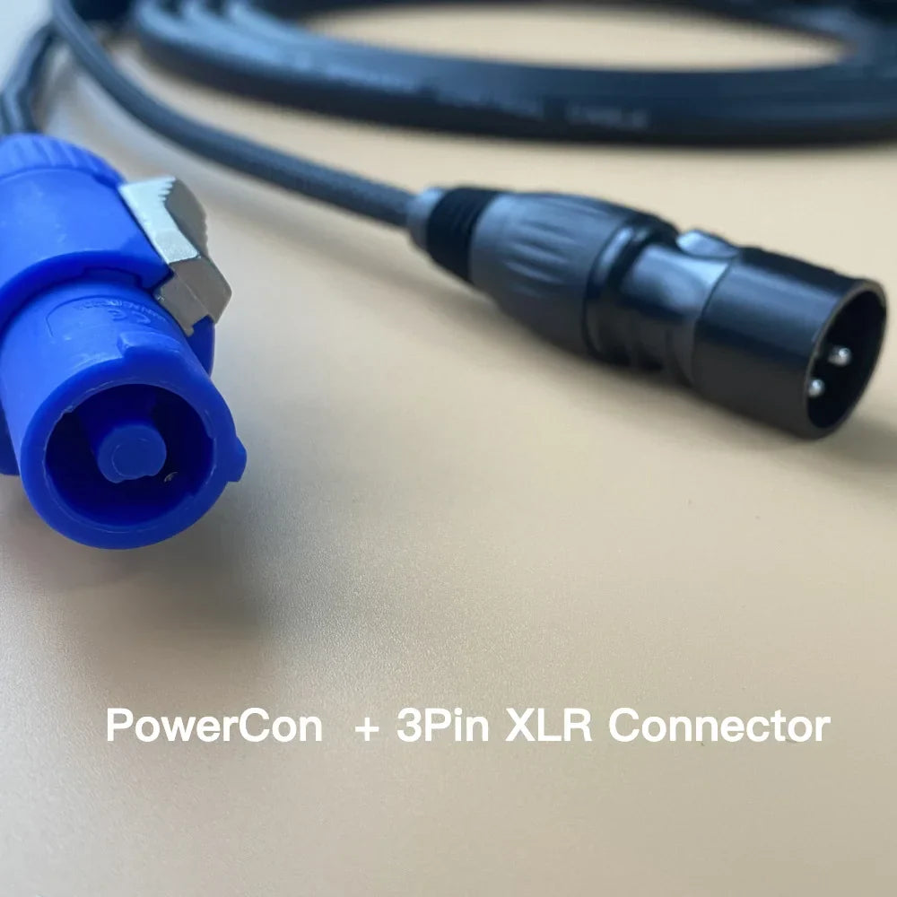 Blue powercon power wire paired with black 3pin xlr male plug on coiled cable for wire stage lighting use