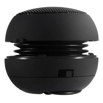 Black spherical portable speaker with mesh grille and coiled spring design for portable speaker travel and hifi 3d surround use