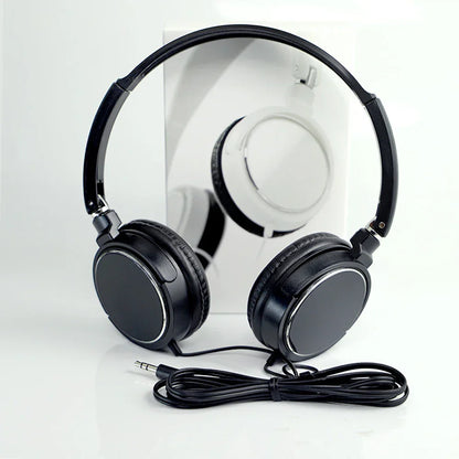 Black foldable headphones bass with padded earcups and coiled cable plug wired headphones for music devices