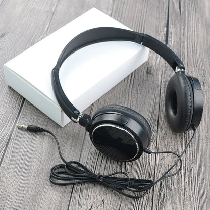 Black foldable headphones bass with padded earcups and coiled cable plug wired headphones for fashion music use