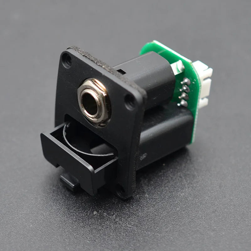 Black plastic guitar jack with metallic silver input socket and green circuit board for 3 band electronic ukulele pickup guitar eq equalize