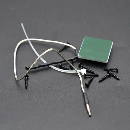 Black and silver electronic ukulele pickup cable with green adhesive pad for 3 band guitar eq equalize tuner system