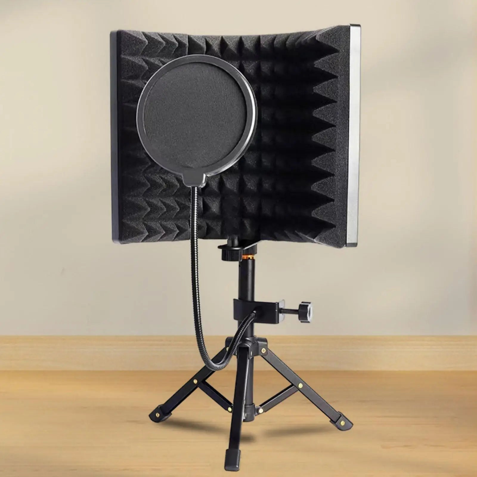 Black foam windscreen with circular mesh filter mounted on tripod stand for microphone isolation shield vocal recording panel