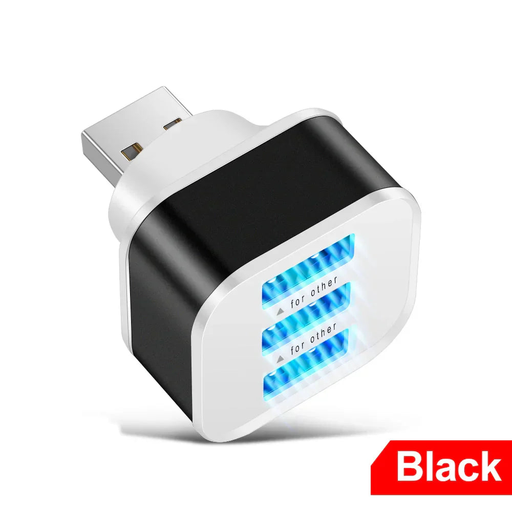 Black usb 3.0 hub quick charge with three glowing blue ports and silver connector for expander phone tablet charging