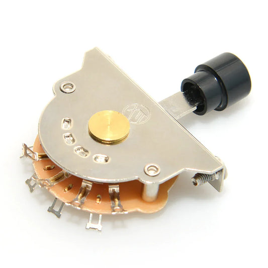 Silver-toned electric guitar switch metal rotary with black knob gold center and screws on orange circuit board base