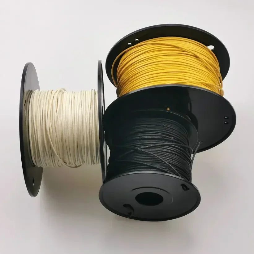 Three spools of gavitt fabric pre-dyed 7-strand push 22-watt retro style insulated wire in white black and yellow on reels