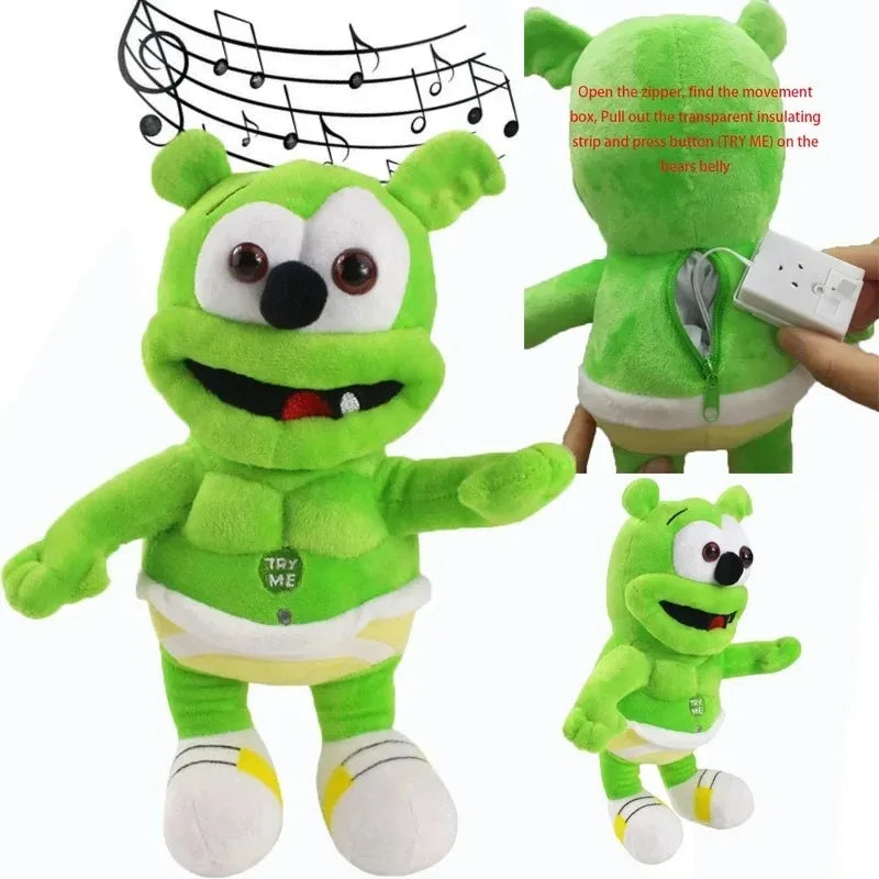 Green singing gummy plush toy with built-in speaker wearing white diaper and yellow accents peluche sounding bear for kids