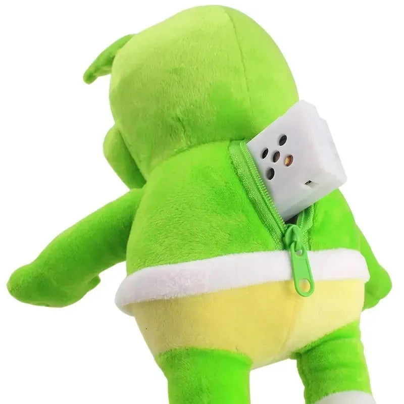 A lime green singing gummy plush with a white zipper, yellow belly, and electric outlet in back pocket peluche sounding bear
