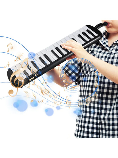 Black and white keys melodica instrument with soft blow pipe and gold musical notes swirling around pipe blowing nozzles