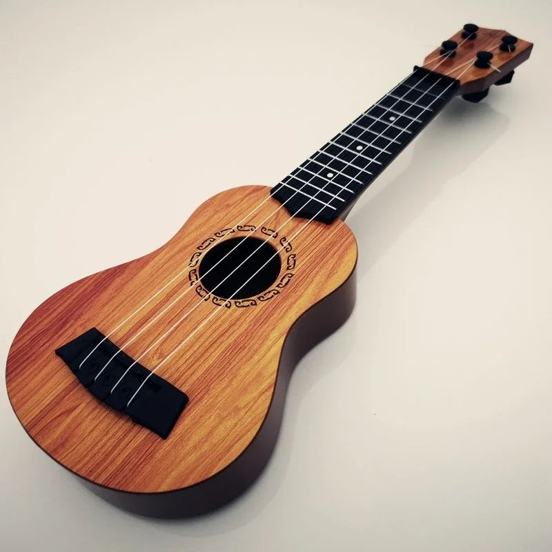 A light brown wooden 35cm ukulele children toy with black fretboard and paddles simulating yukrili music toys