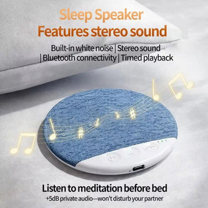 Blue textured fabric pillow speaker with white plastic base and control buttons featuring surround sound bluetooth and white noise timer