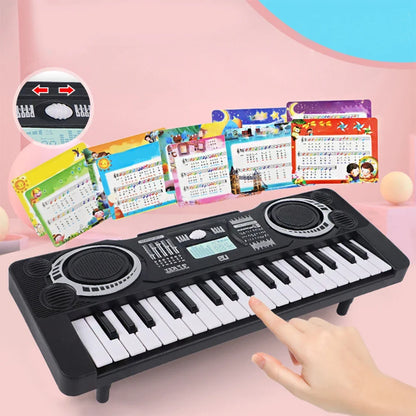 Black plastic electronic piano keyboard with white and black keys silver speaker grilles and digital display portable educational toy musical instrument organ