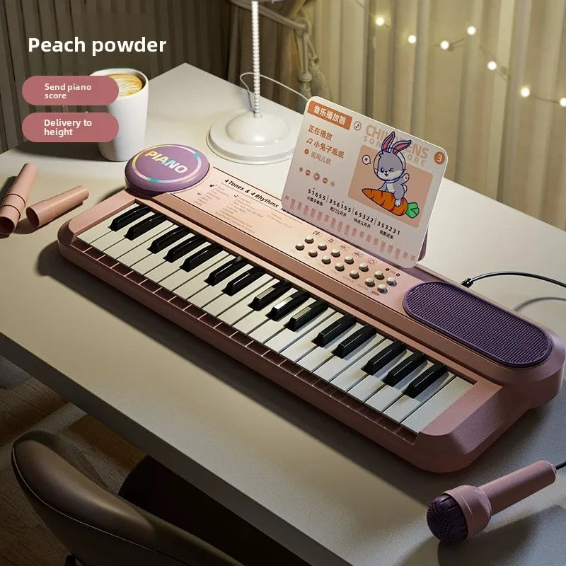 Peach powder-colored kids piano keyboard with black and white keys purple speaker grille and matching microphone music score for early learning interactive play