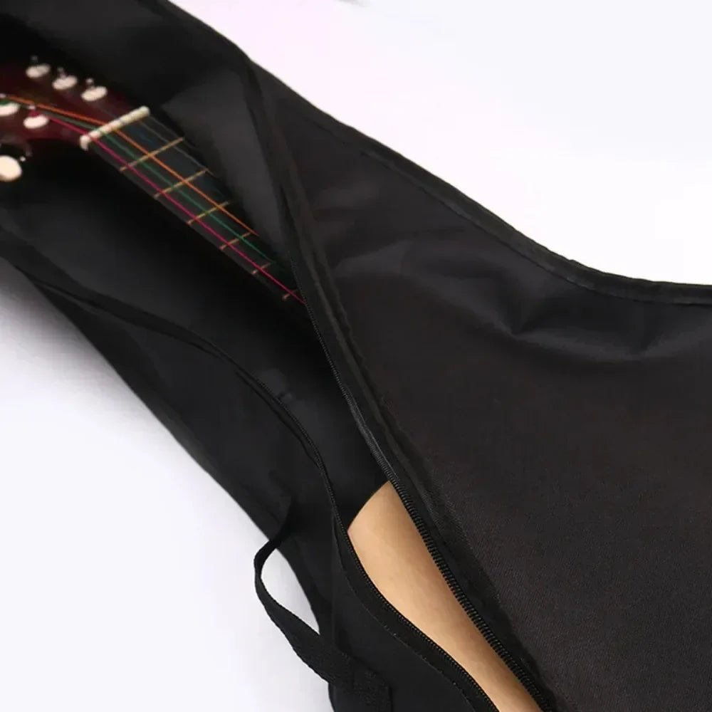 Black nylon 38/41 inch oxford fabric guitar bag with zipper opening reveals padded acoustic guitar waterproof case
