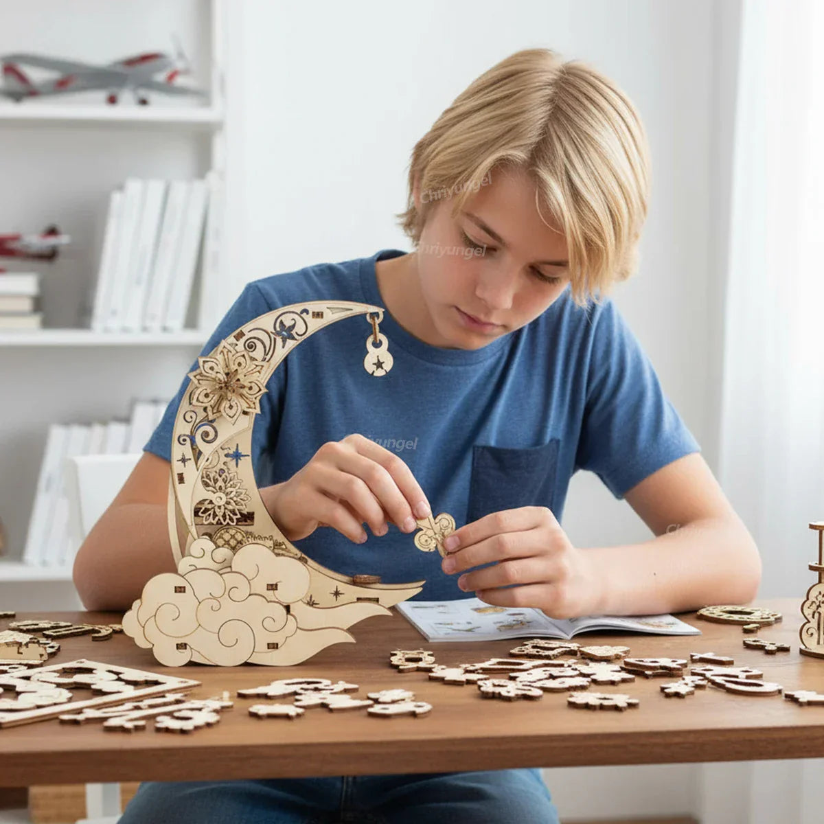 Intricately designed light-colored wooden puzzle moon and cloud set for kits rotating craft decor educational use