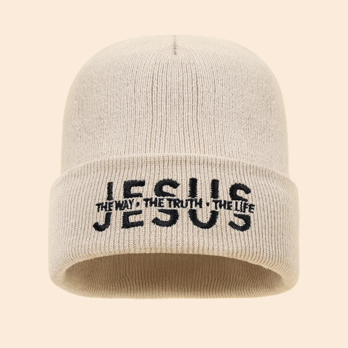 Beige knit beanie with black embroidered jesus the way the truth the life text on the folded cuff for autumn winter use