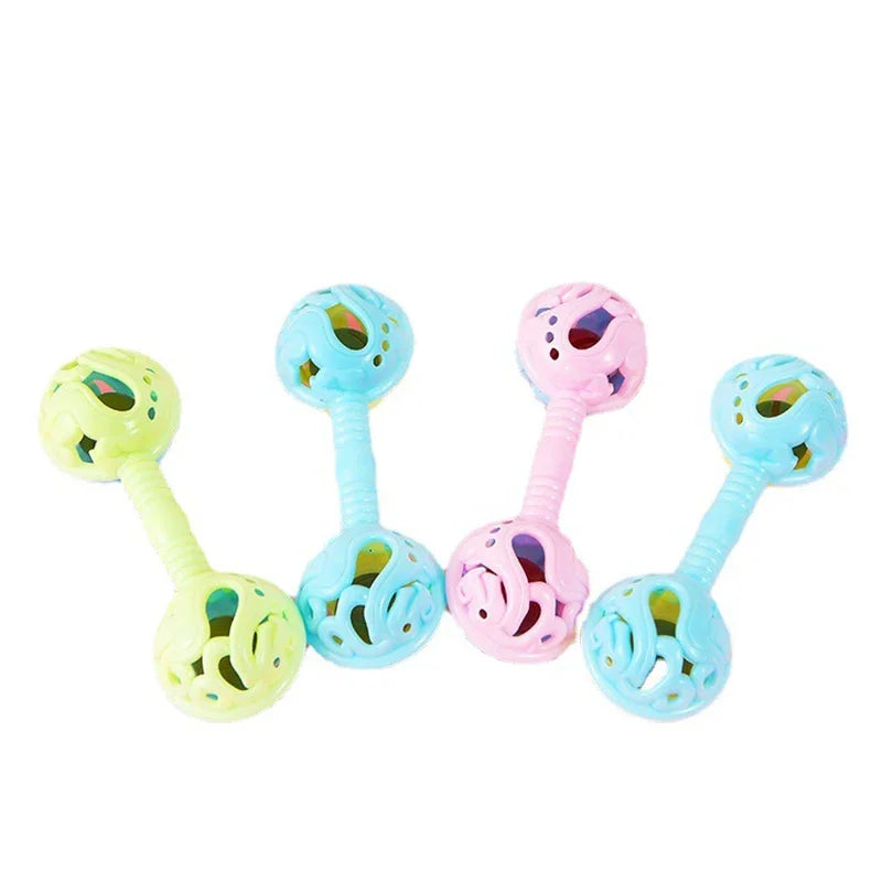 Pastel-colored plastic double-headed small toy rattle with perforated ends and central handle for toy baby shower holding bell gift