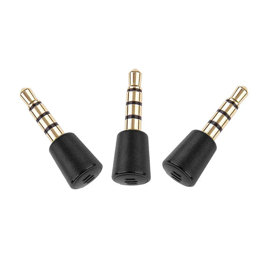 Three black and gold 3.5mm metal plug portable audio adapters with textured bases for portable recording gamepad and live broadcast microphone use