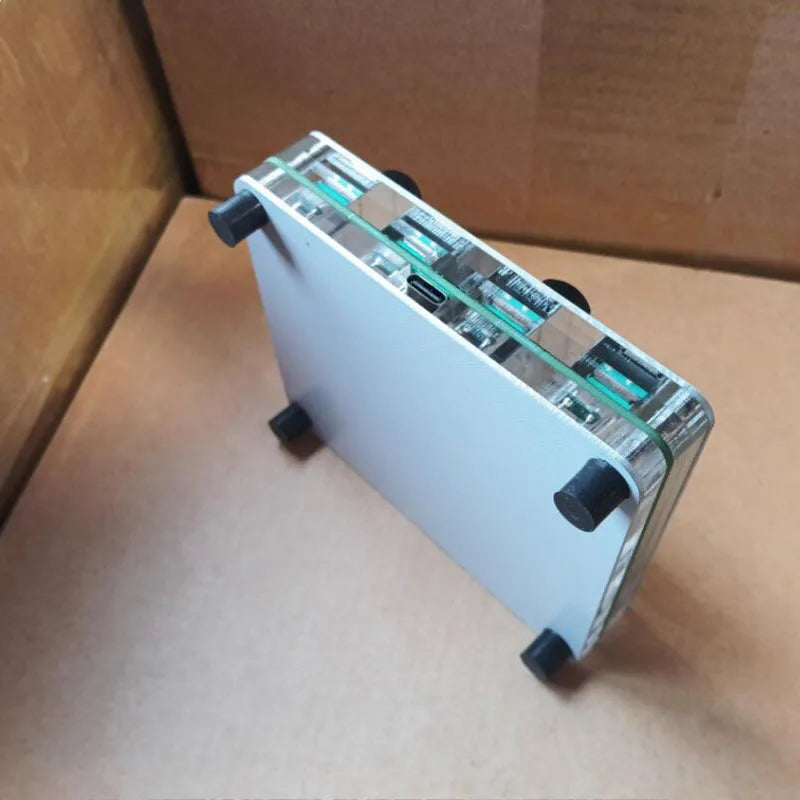 Silver aluminum-framed 4-channel midi push rod with transparent panels revealing green-tinted 42mm fader custom circuitry