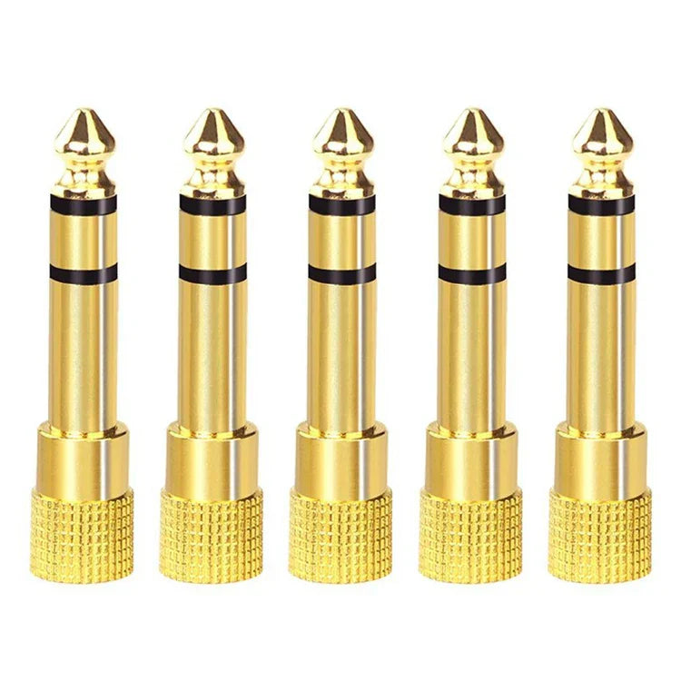 Five gold-colored 3.5mm adapter plugs with black bands for headphone amplifier ha400 stereo audio amplifier use
