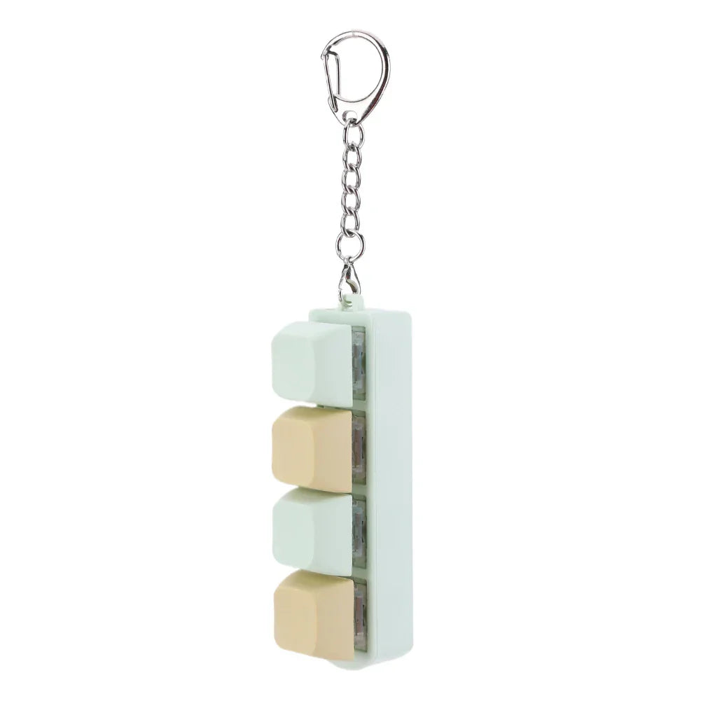 Pastel green and beige keycap fidget keychain with silver chain and clip for keyboard clicker toy and adult gifts